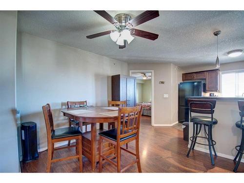 7413-304 Mackenzie Way Sw, Airdrie, AB - Indoor Photo Showing Dining Room