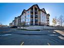 7413-304 Mackenzie Way Sw, Airdrie, AB  - Outdoor With Facade 