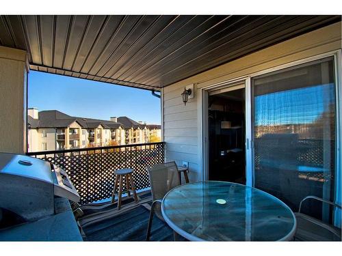 7413-304 Mackenzie Way Sw, Airdrie, AB - Outdoor With Deck Patio Veranda With Exterior