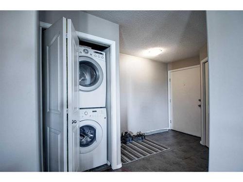 7413-304 Mackenzie Way Sw, Airdrie, AB - Indoor Photo Showing Laundry Room