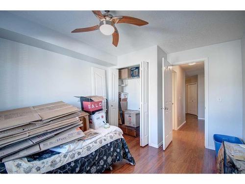 7413-304 Mackenzie Way Sw, Airdrie, AB - Indoor Photo Showing Bedroom