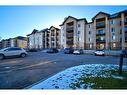 7413-304 Mackenzie Way Sw, Airdrie, AB  - Outdoor With Facade 