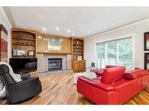 143 Christie Knoll Heights Sw, Calgary, AB - Indoor Photo Showing Living Room With Fireplace