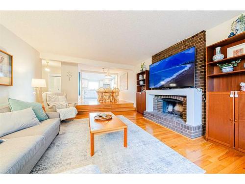 7803 Silver Springs Road Nw, Calgary, AB - Indoor Photo Showing Living Room With Fireplace