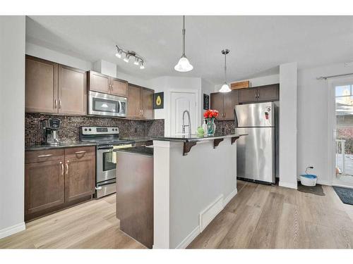 131 Prestwick Villas Se, Calgary, AB - Indoor Photo Showing Kitchen With Stainless Steel Kitchen With Upgraded Kitchen