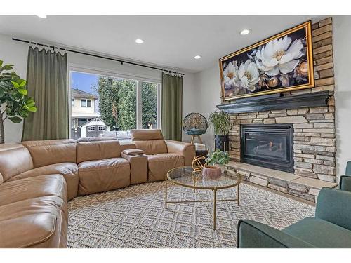 303 Coral Sands Terrace Ne, Calgary, AB - Indoor Photo Showing Living Room With Fireplace