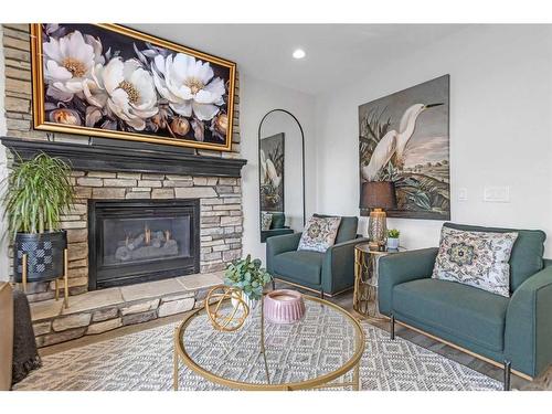 303 Coral Sands Terrace Ne, Calgary, AB - Indoor Photo Showing Living Room With Fireplace