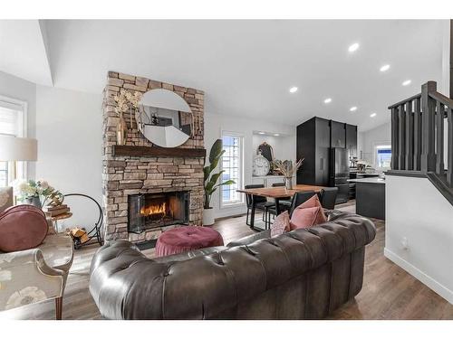 303 Coral Sands Terrace Ne, Calgary, AB - Indoor Photo Showing Living Room With Fireplace