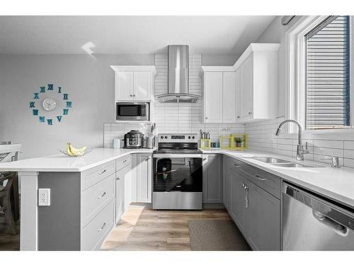 183 Seton Heath Se, Calgary, AB - Indoor Photo Showing Kitchen With Double Sink