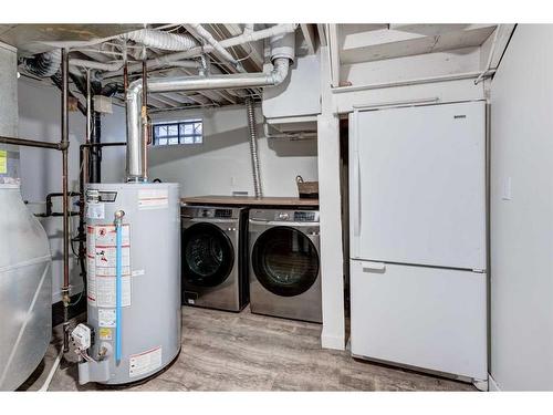 11 Alcock Close, Okotoks, AB - Indoor Photo Showing Laundry Room