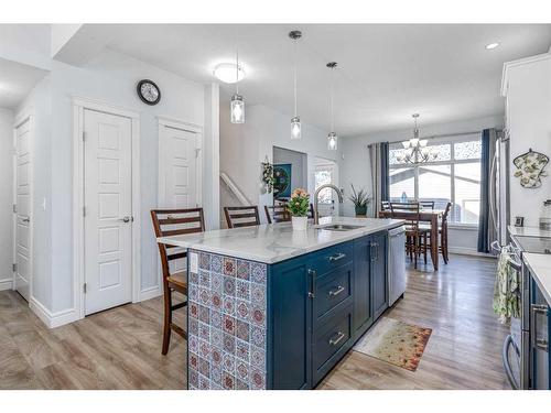 32 Clydesdale Crescent, Cochrane, AB - Indoor Photo Showing Kitchen With Double Sink