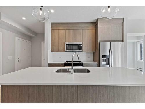 3104-111 Wolf Creek Drive Se, Calgary, AB - Indoor Photo Showing Kitchen With Upgraded Kitchen