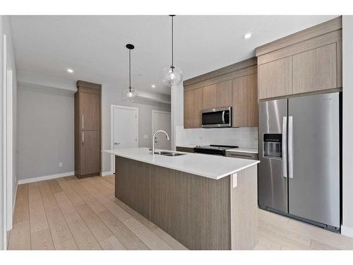 3104-111 Wolf Creek Drive Se, Calgary, AB - Indoor Photo Showing Kitchen With Double Sink With Upgraded Kitchen