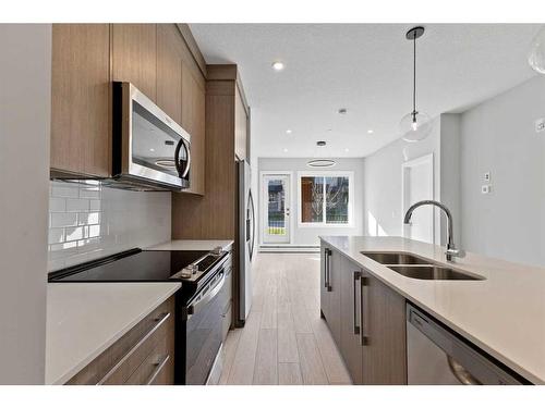 3104-111 Wolf Creek Drive Se, Calgary, AB - Indoor Photo Showing Kitchen With Double Sink With Upgraded Kitchen