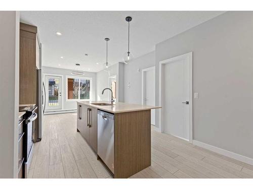 3104-111 Wolf Creek Drive Se, Calgary, AB - Indoor Photo Showing Kitchen With Upgraded Kitchen