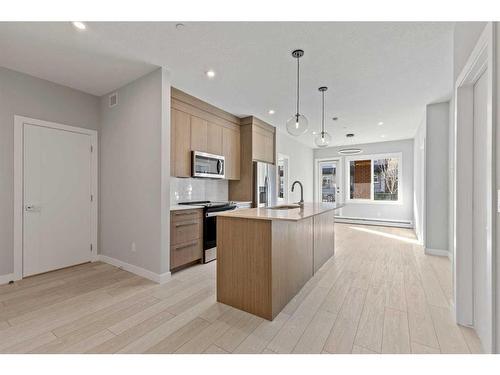 3104-111 Wolf Creek Drive Se, Calgary, AB - Indoor Photo Showing Kitchen With Upgraded Kitchen