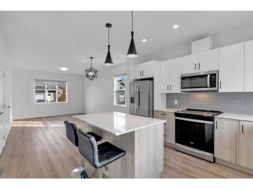 118-137 Red Embers Link Ne, Calgary, AB - Indoor Photo Showing Kitchen With Stainless Steel Kitchen With Upgraded Kitchen