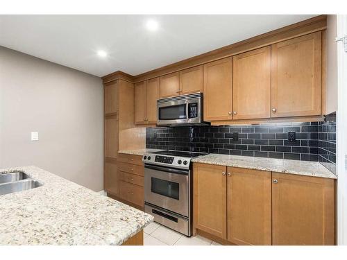 2301-910 5 Avenue Sw, Calgary, AB - Indoor Photo Showing Kitchen With Double Sink