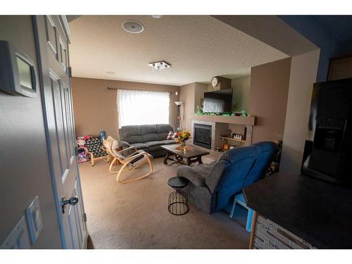 184 Copperfield Rise Se, Calgary, AB - Indoor Photo Showing Living Room With Fireplace