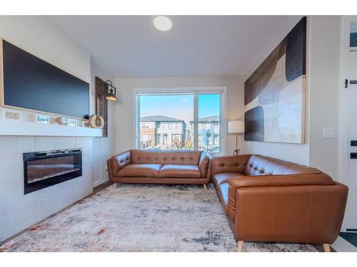 77 Homestead Boulevard Ne, Calgary, AB - Indoor Photo Showing Living Room With Fireplace