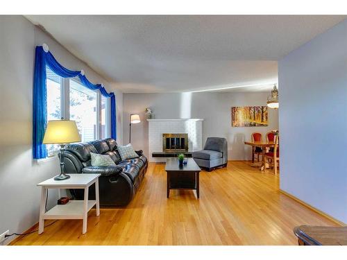 308 Sackville Drive Sw, Calgary, AB - Indoor Photo Showing Living Room With Fireplace