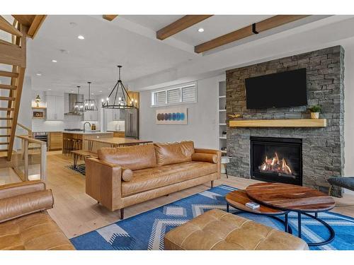 2-802 5 Th Street, Canmore, AB - Indoor Photo Showing Living Room With Fireplace