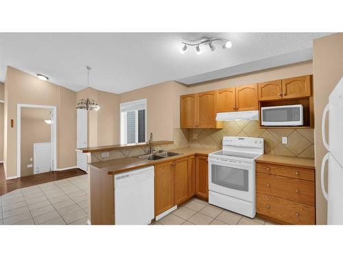 40 Saddlefield Road Ne, Calgary, AB - Indoor Photo Showing Kitchen With Double Sink