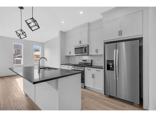 37 Amblefield Passage Nw, Calgary, AB - Indoor Photo Showing Kitchen With Stainless Steel Kitchen With Double Sink With Upgraded Kitchen