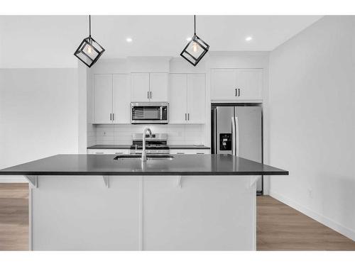 37 Amblefield Passage Nw, Calgary, AB - Indoor Photo Showing Kitchen With Stainless Steel Kitchen With Double Sink With Upgraded Kitchen