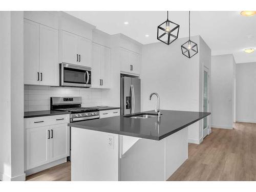 37 Amblefield Passage Nw, Calgary, AB - Indoor Photo Showing Kitchen With Stainless Steel Kitchen With Upgraded Kitchen