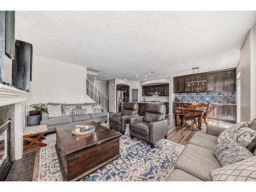 136 Saddlecrest Green Ne, Calgary, AB - Indoor Photo Showing Living Room With Fireplace