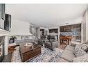 136 Saddlecrest Green Ne, Calgary, AB  - Indoor Photo Showing Living Room With Fireplace 