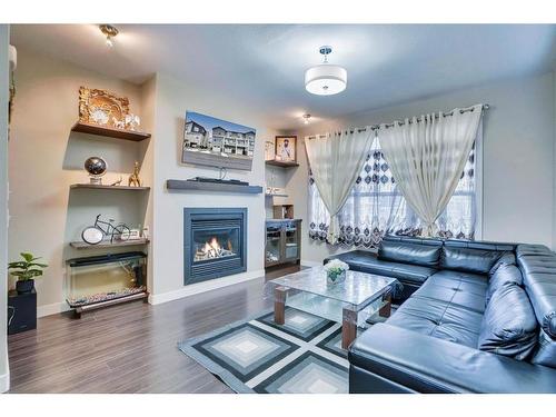 136 Redstone View Ne, Calgary, AB - Indoor Photo Showing Living Room With Fireplace