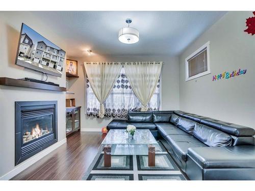 136 Redstone View Ne, Calgary, AB - Indoor Photo Showing Living Room With Fireplace