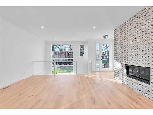 3318 42 Street Sw, Calgary, AB - Indoor Photo Showing Living Room With Fireplace