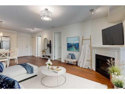 2211-279 Copperpond Common Se, Calgary, AB - Indoor Photo Showing Living Room With Fireplace