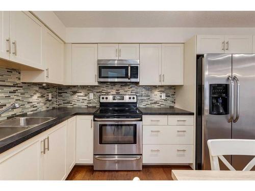 2211-279 Copperpond Common Se, Calgary, AB - Indoor Photo Showing Kitchen With Stainless Steel Kitchen With Double Sink With Upgraded Kitchen