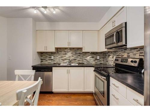 2211-279 Copperpond Common Se, Calgary, AB - Indoor Photo Showing Kitchen With Stainless Steel Kitchen With Double Sink With Upgraded Kitchen