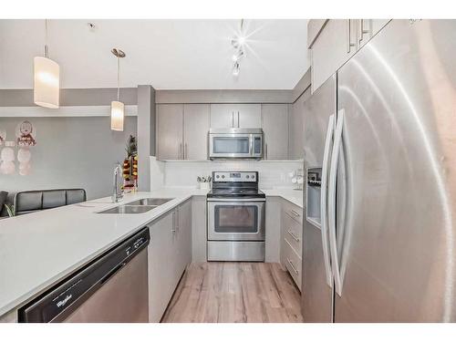 7311-302 Skyview Ranch Drive Ne, Calgary, AB - Indoor Photo Showing Kitchen With Stainless Steel Kitchen With Double Sink With Upgraded Kitchen