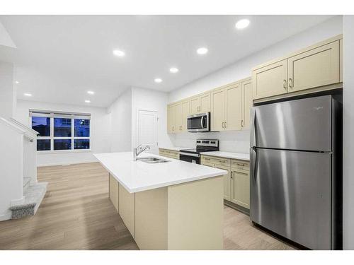 184 Belmont Way Sw, Calgary, AB - Indoor Photo Showing Kitchen With Stainless Steel Kitchen With Double Sink With Upgraded Kitchen