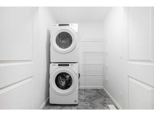 184 Belmont Way Sw, Calgary, AB - Indoor Photo Showing Laundry Room