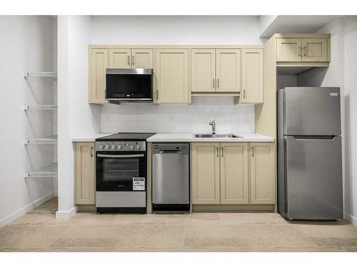 184 Belmont Way Sw, Calgary, AB - Indoor Photo Showing Kitchen With Stainless Steel Kitchen