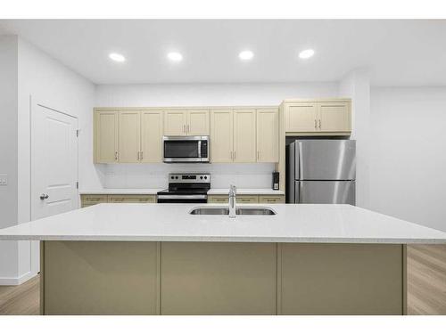 184 Belmont Way Sw, Calgary, AB - Indoor Photo Showing Kitchen With Stainless Steel Kitchen With Double Sink With Upgraded Kitchen