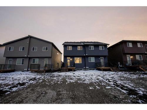 184 Belmont Way Sw, Calgary, AB - Outdoor With Deck Patio Veranda With Facade