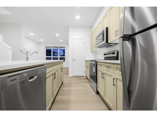 184 Belmont Way Sw, Calgary, AB - Indoor Photo Showing Kitchen With Stainless Steel Kitchen With Upgraded Kitchen