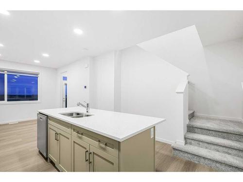 184 Belmont Way Sw, Calgary, AB - Indoor Photo Showing Kitchen With Double Sink