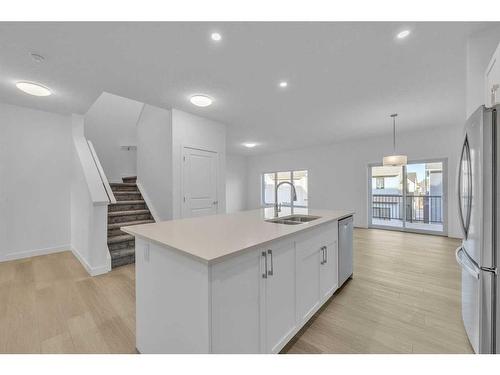 305 Baneberry Way Sw, Airdrie, AB - Indoor Photo Showing Kitchen With Double Sink