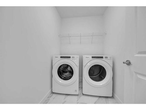 305 Baneberry Way Sw, Airdrie, AB - Indoor Photo Showing Laundry Room