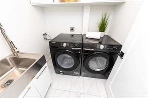 908 87 Avenue Sw, Calgary, AB - Indoor Photo Showing Laundry Room