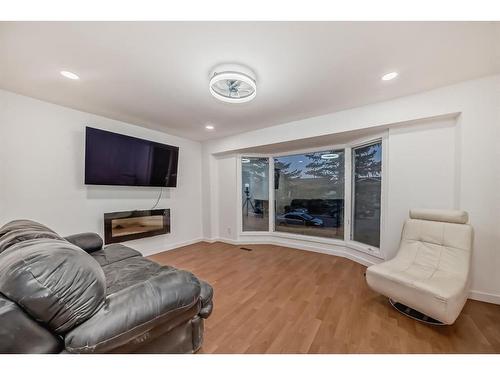 392 Falmere Road Ne, Calgary, AB - Indoor Photo Showing Living Room With Fireplace